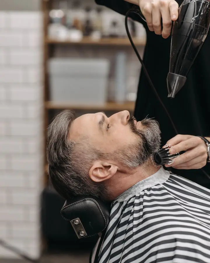 Beard being blow-dried and styled