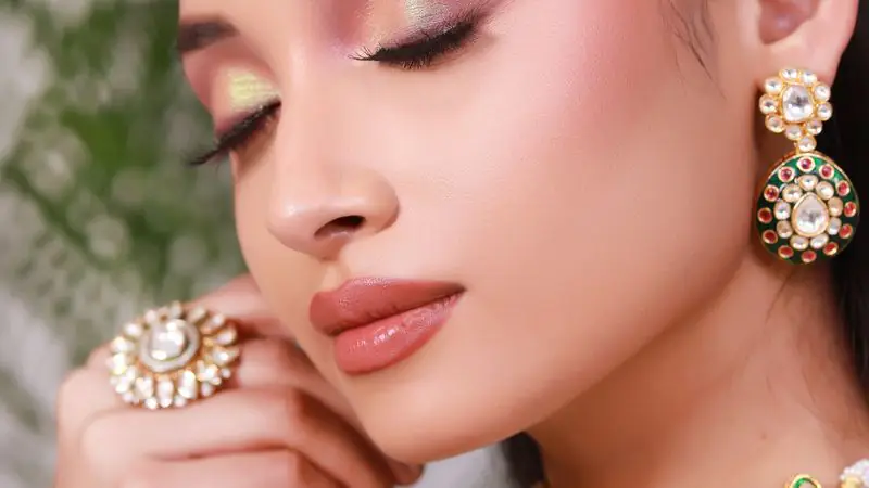 Soft bridal makeup with gold jewellery