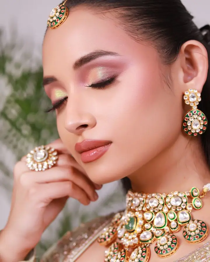 Soft bridal makeup with gold jewellery
