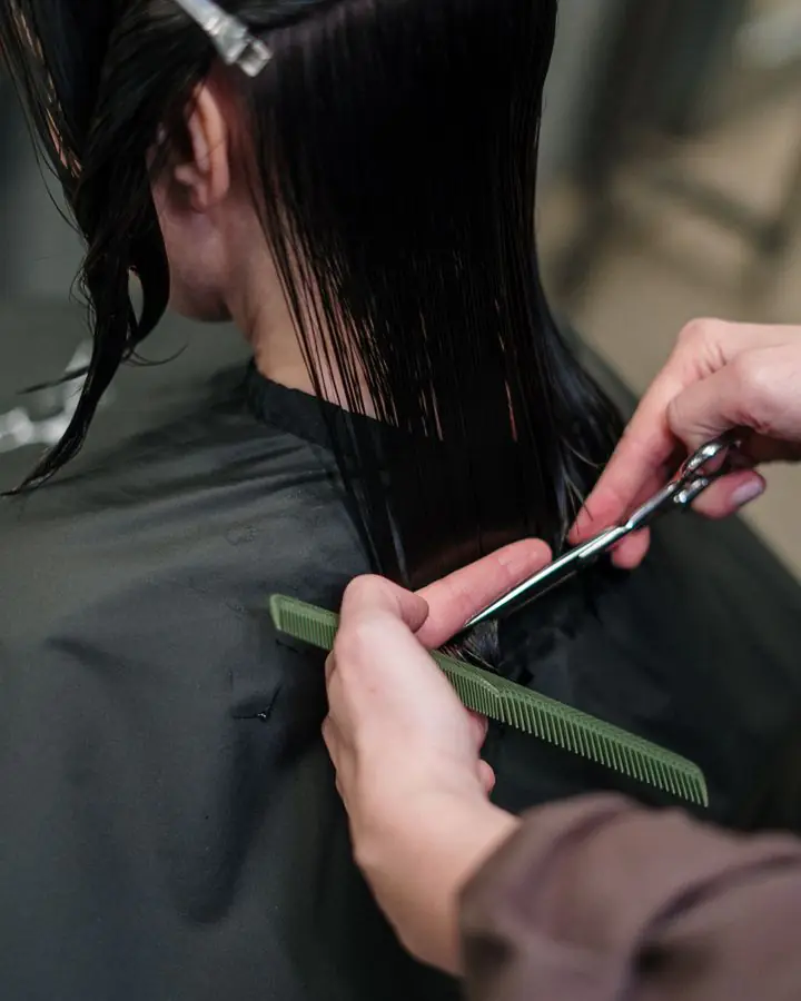 Close-up of a precision cut on long dark hair