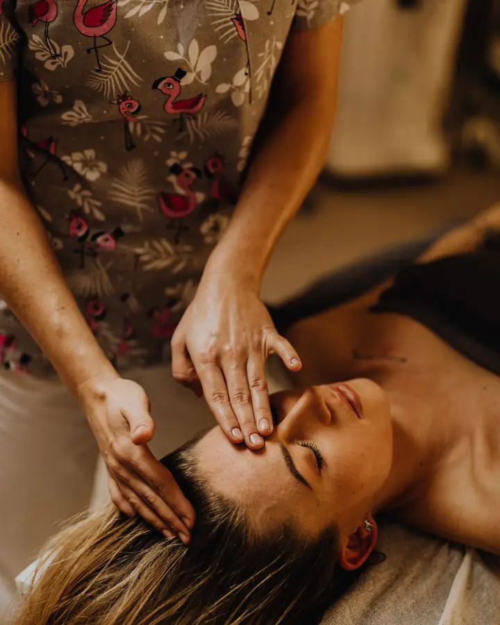 Head and face massage on the treatment bed