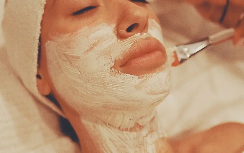 Facial mask being brushed on