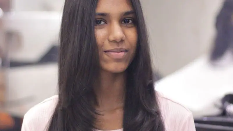 Woman with long, sleek straight dark hair
