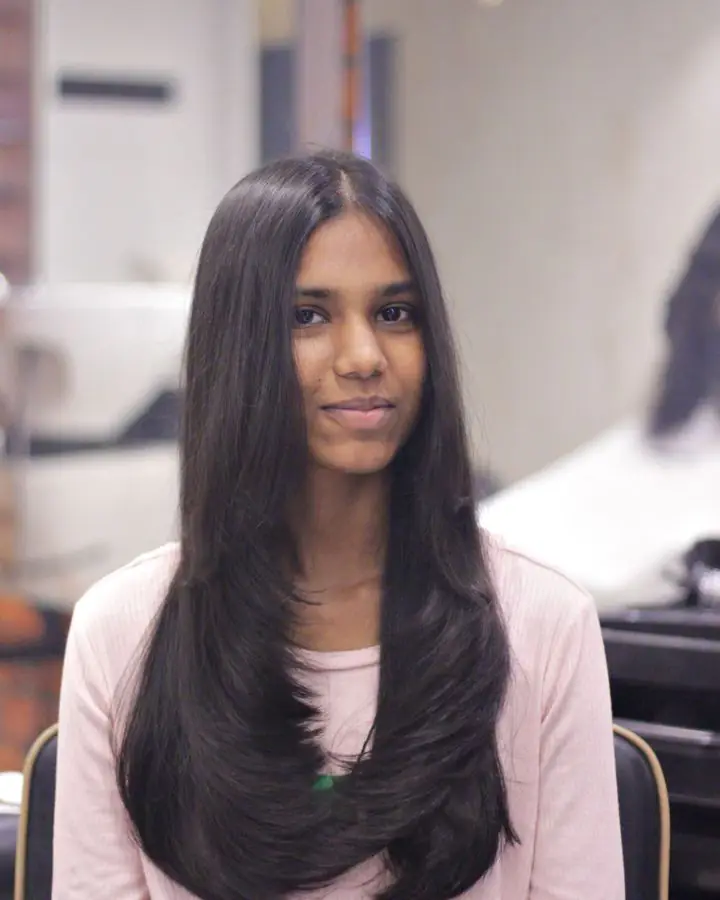 Woman with long, sleek straight dark hair