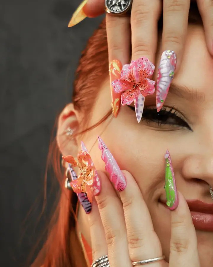 Long nail extensions with hand-painted nail art