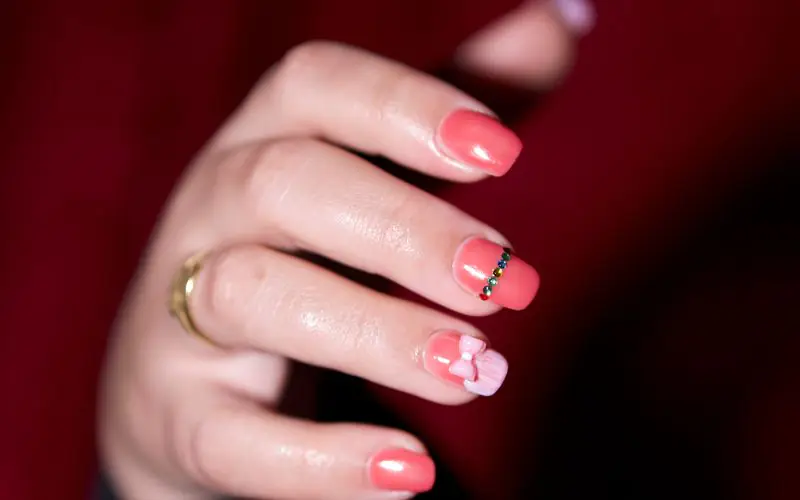 Pink gel nails with fine detailing